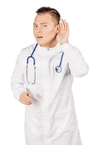 Jeune médecin masculin en manteau blanc et stéthoscope tenant la main ne — Photo