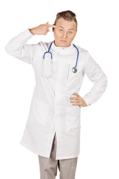 Young male doctor in white coat gesturing with her finger agains — ストック写真