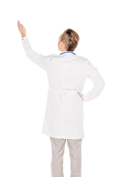 Young male doctor in white coat directional pointing at distance — 스톡 사진