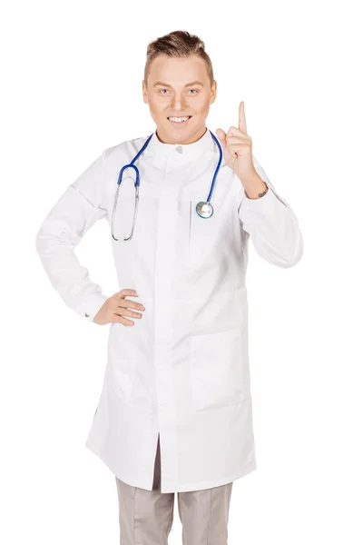 Young  male doctor in white coat and stethoscope finger point up — Stock Photo, Image