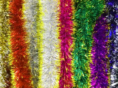 Çok renkli ve altın sarısı bir girdap içine kıvrılmış. Noel ya da yeni yıl geçmişi. Flatley 'e yakın çekim. Minimalizm.