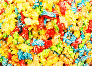 Bir sürü şeker. Bir sürü şeker. Arkaplan kullanan renkli bir doku. Arkaplan çizimi. Pudra şekerli parlak çoklu jöle şekeri. Şekerleme duvar kağıdı konsepti. Uzayı kopyala Sığ odaklanma. Yakın plan.