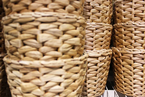 several wicker baskets at an outdoor counter in a street market Vintage weave wicker basket background
