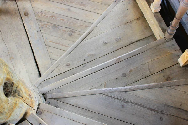 antique spiral staircase - wooden steps Open staircase, wooden spiral staircase in home interior Entrance doors to the old staircase