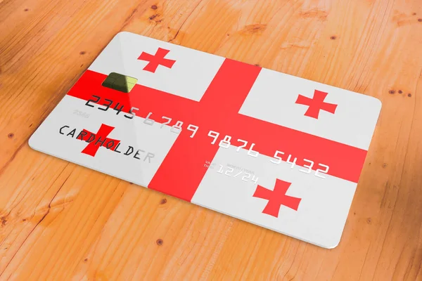 Plastic credit or bank debit card with country flag of Georgia national banking system isolated on wooden table close up concept 3d rendering image