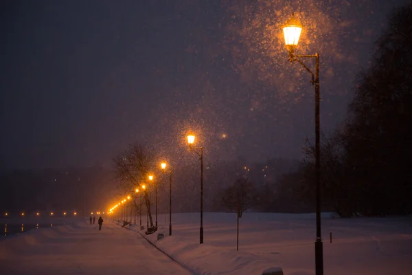 In winter, the river in the snow and lights