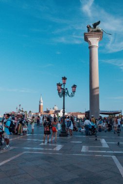 Lion statue on San Marko square in Venice, Italy. View of the Venice lagoon.