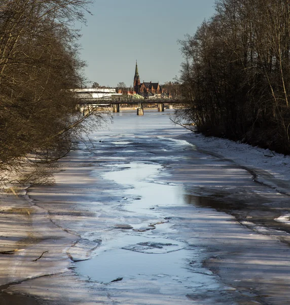 Thawing River with Distant Church — Stock Photo, Image