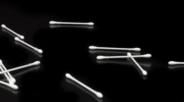 Cotton Swabs on Black Background — Stock Photo, Image