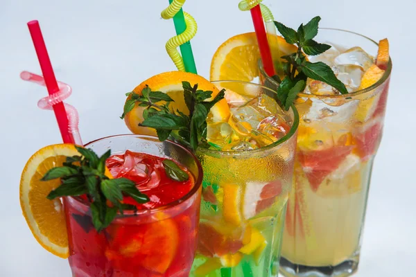 Glasses Of Drink With Ice Cubes And Fruits