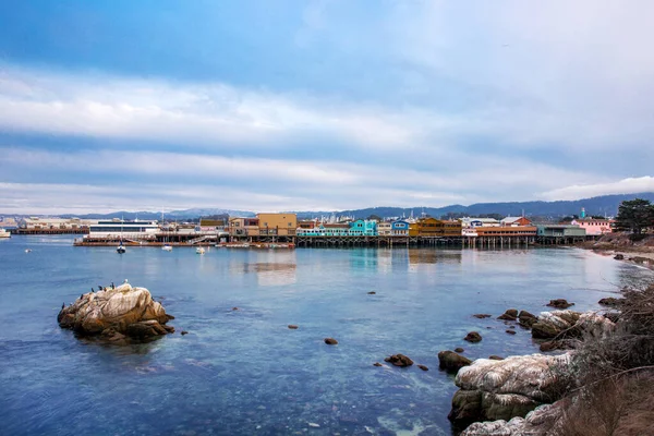 The Pacific Ocean coast in the city of Monterey in California. United States of America. Beautiful beach on a sunny day. Ocean landscape.