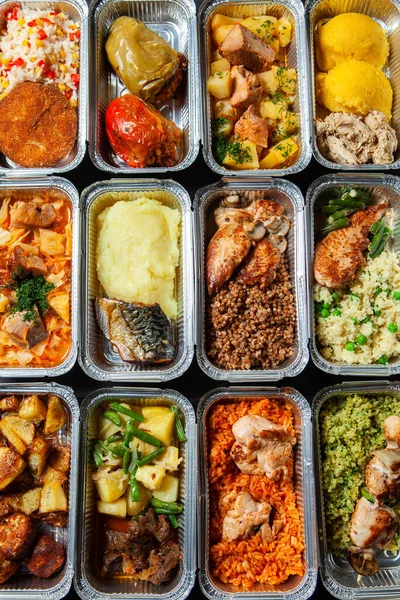 Business lunch in eco plastic container ready for delivery.Top view. Office Lunch boxes with food ready to go. Food takes away. Catering, brakfast.