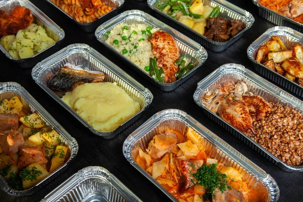 Business lunch in eco plastic container ready for delivery.Top view. Office Lunch boxes with food ready to go. Food takes away. Catering, brakfast.