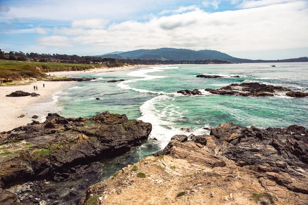 The Pacific Ocean coast in the city of Monterey in California. United States of America. Beautiful beach on a sunny day. Ocean landscape.