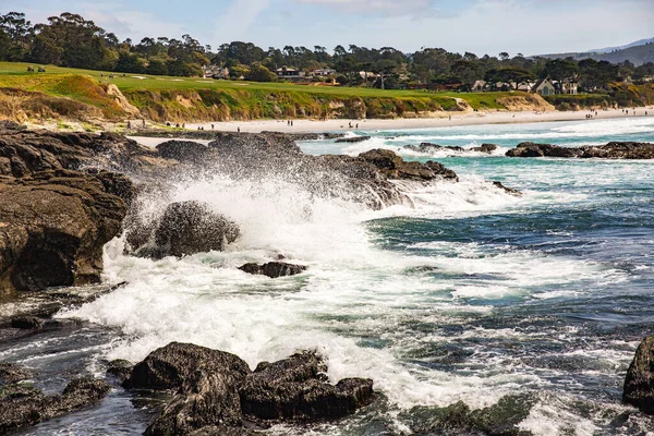 The Pacific Ocean coast in the city of Monterey in California. United States of America. Beautiful beach on a sunny day. Ocean landscape.