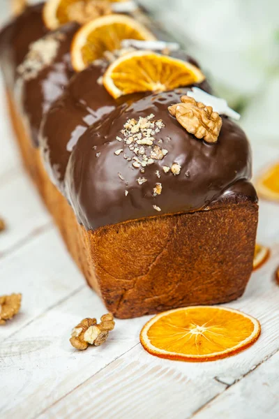 Panettone is the traditional Italian dessert for easter in 2021. Homemade panettone covered in chocolate. Sweet Bread served as dessert.