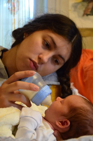 Young Mother Feeding Her Baby Room — Stock Photo, Image