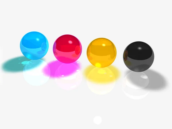 Bolas de vidro CMYK em um fundo branco — Fotografia de Stock