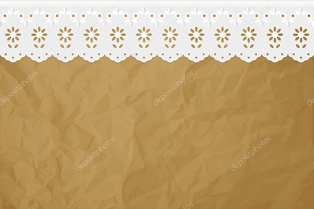 Openwork embroidery on crumpled paper brown background