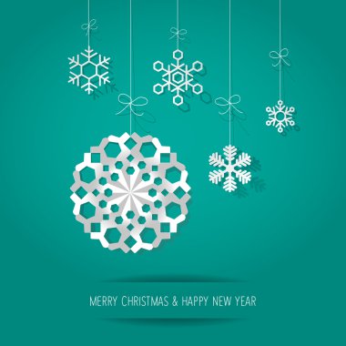 Turkuaz bir arka plan üzerinde Noel kağıt kar taneleri