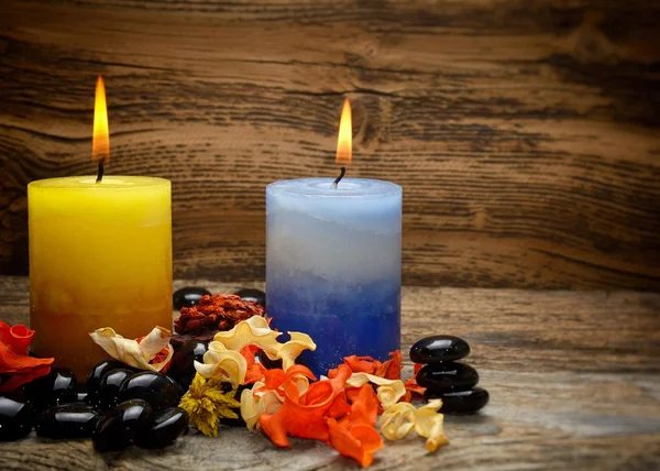Zen stones and aromatic candles dry flowers Royalty Free Stock Photos