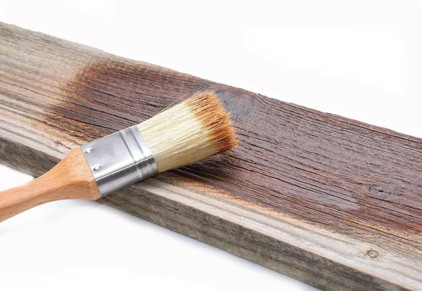 Paint brush on wood — Stock Photo, Image