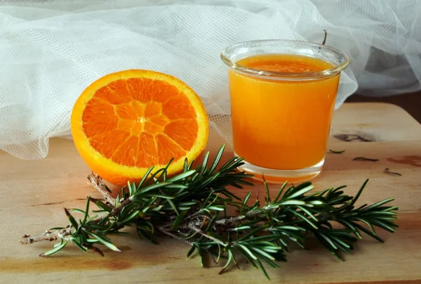 Healthy fresh orange smoothie on a glass.