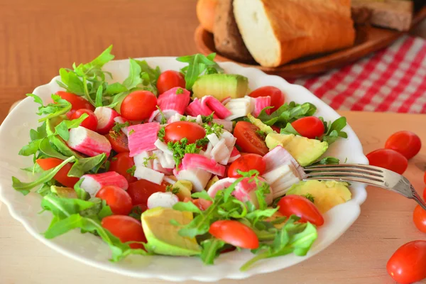 Mixed vegetable salad with crab sticks and avocado — Stock Image Mixed vegetable salad with crab sticks and avocado Royalty Free Stock Images