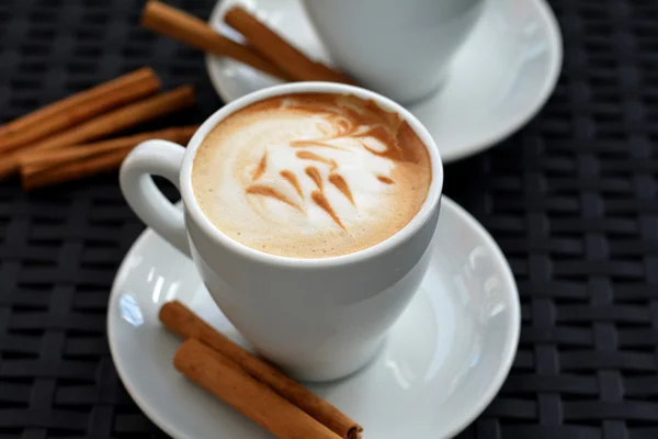 Delicious foamy cappuccino on the black background — Stock Photo, Image