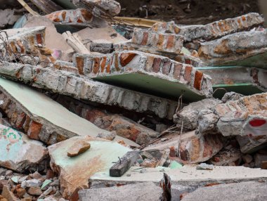 Devastated Building Ruins with Scattered Brick and Concrete Rubble, War Destruction Scenery of Destroyed House Wall, Forced Eviction Debris and Shattered Urban Structure Background