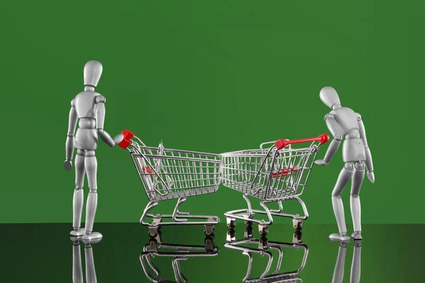 Dummies with carts on shopping. — Stock Photo, Image
