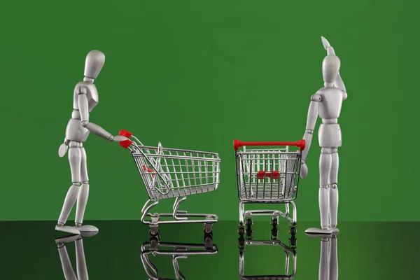 Dummies with carts on shopping. — Stock Photo, Image