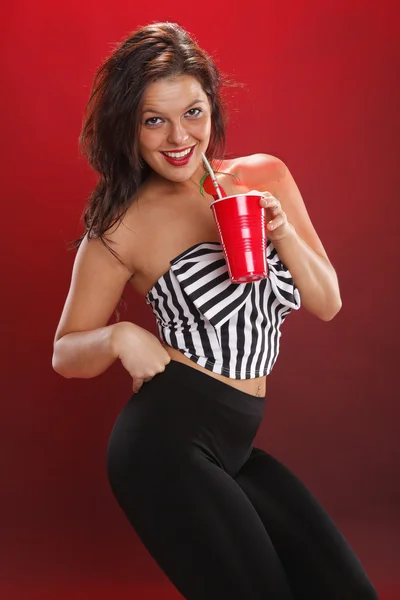 Brunette girl with a drink — Stock Photo, Image