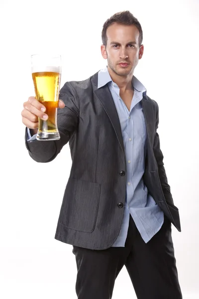 Young man drinks a beer — Stock Photo, Image