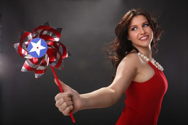 Woman holding patriotic pinwheel — Stock Photo, Image