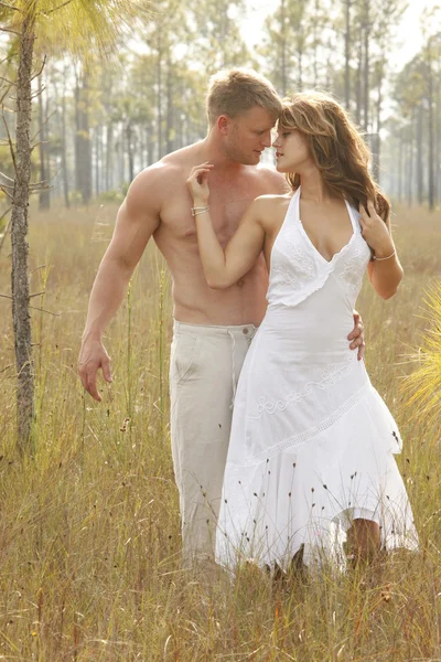 Love couple on wild grass — Stock Photo, Image