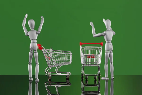 Dummies with carts on shopping. — Stock Photo, Image