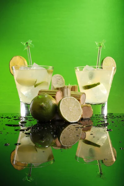 Caipirinha with sugar cane and lime — Stock Photo, Image