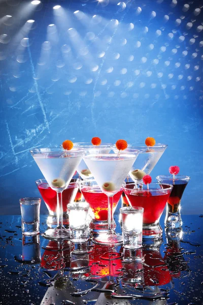 Cocktails glasses on blue — Stock Photo, Image