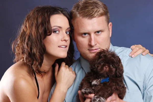 Young couple with a dog — Stock Photo, Image