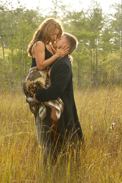 Love couple on wild grass — Stock Photo, Image