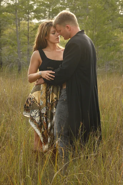 Love couple on wild grass — Stock Photo, Image