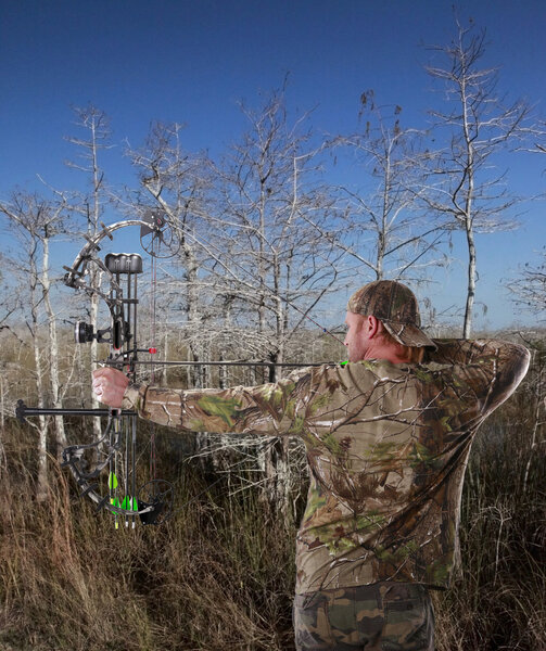 Man hunting with a compound bow