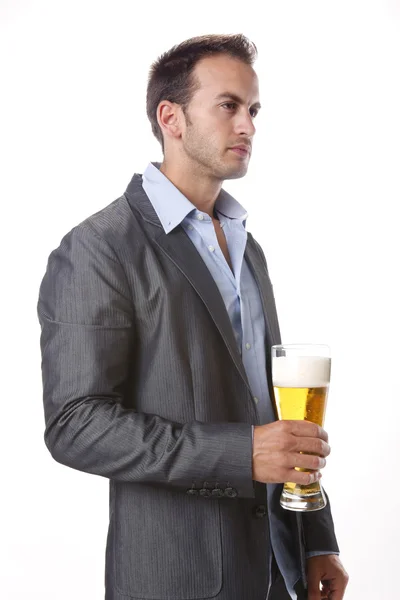 Young man drinks a beer — Stock Photo, Image