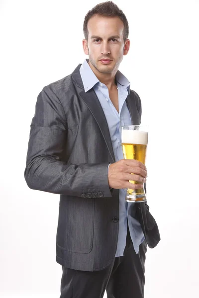 Young man drinks a beer — Stock Photo, Image