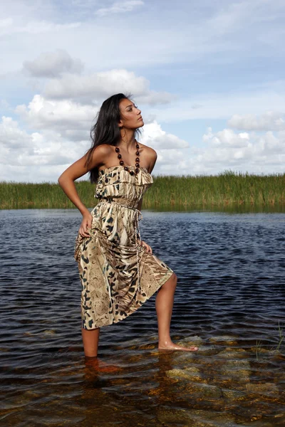 Girl standing in water — Stock Photo, Image