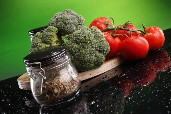 Broccoli, tomatoes, lime and spices — Stock Photo, Image