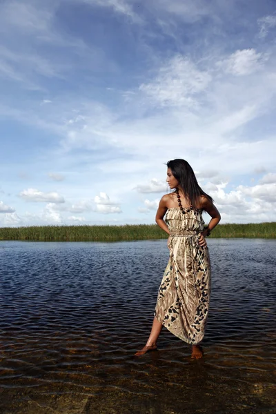 Girl standing in water — Stock Photo, Image