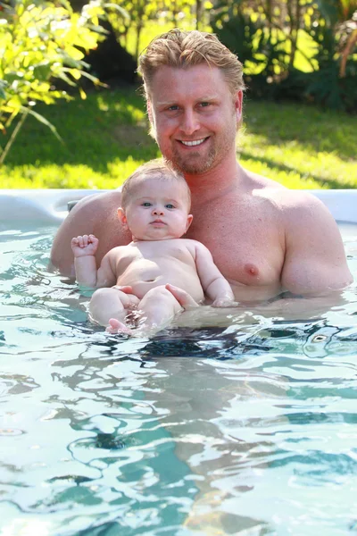 Father and daughter in the pool — Stock Photo, Image