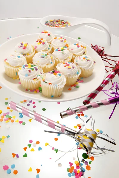 Snow white sprinkled fresh cupcakes — Stock Photo, Image